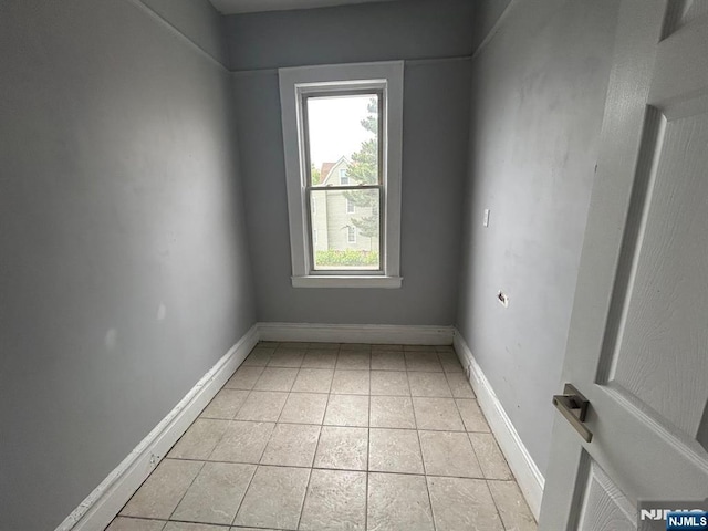 207 Tremont Ave, East Orange, NJ 07018 - empty room with light tile patterned floors and baseboards