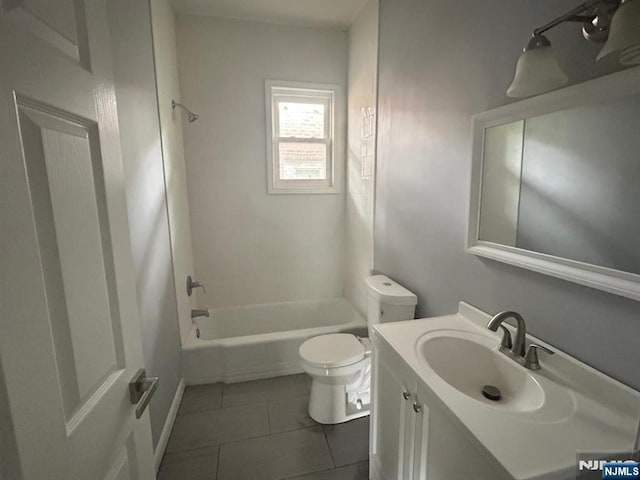 207 Tremont Ave, East Orange, NJ 07018 - bathroom with toilet, vanity, tub / shower combination, and tile patterned floors
