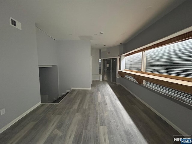 207 Tremont Ave, East Orange, NJ 07018 - unfurnished living room featuring wood finished floors and baseboards