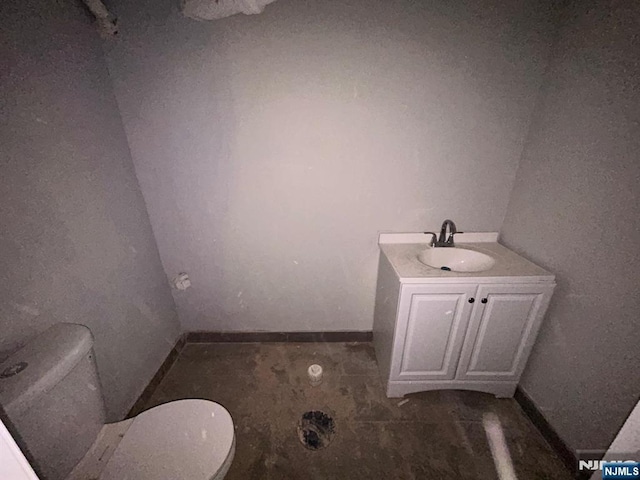 207 Tremont Ave, East Orange, NJ 07018 - bathroom featuring toilet, vanity, and baseboards