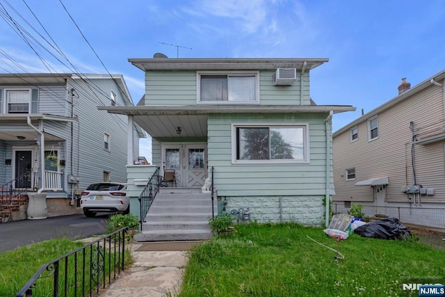 542 3rd Ave, Lyndhurst, NJ 07071 - american foursquare style home featuring covered porch and an AC wall unit