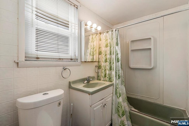 542 3rd Ave, Lyndhurst, NJ 07071 - bathroom featuring vanity, shower / tub combo with curtain, and toilet