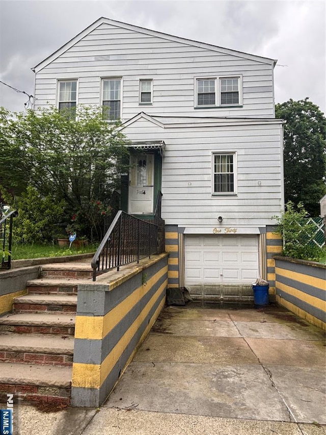 130 Riverview Ave, North Arlington, NJ 07031 - view of front of home featuring a garage and concrete driveway