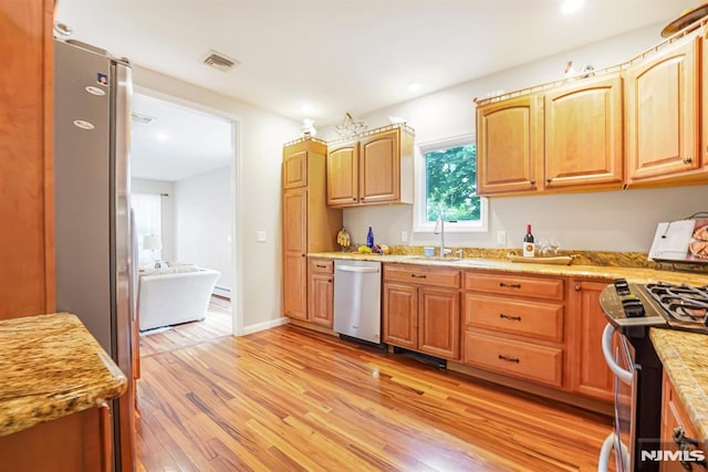 18 Breen Ter, Wayne, NJ 07470 - kitchen with appliances with stainless steel finishes, a sink, light wood-type flooring, recessed lighting, and light stone countertops