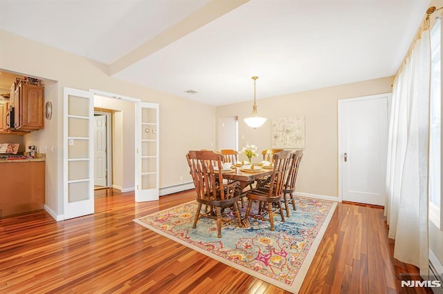 18 Breen Ter, Wayne, NJ 07470 - dining space with a baseboard heating unit, light wood finished floors, french doors, and baseboards