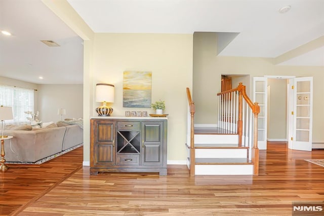 18 Breen Ter, Wayne, NJ 07470 - stairway featuring wood finished floors, baseboards, a baseboard heating unit, and recessed lighting