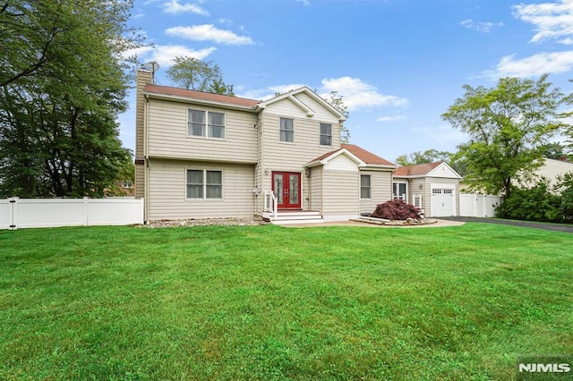 18 Breen Ter, Wayne, NJ 07470 - view of front of property featuring french doors, a chimney, an attached garage, and driveway