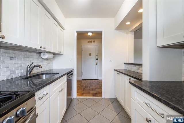 2333 Hudson Ter Unit A4, Fort Lee, NJ 07024 - kitchen with stainless steel dishwasher, backsplash, a sink, and white cabinets