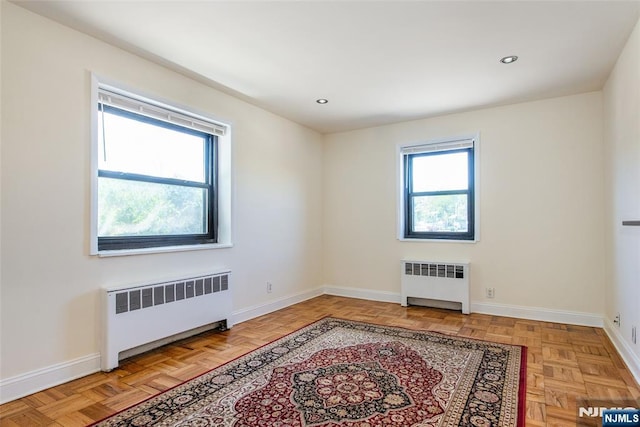 2333 Hudson Ter Unit A4, Fort Lee, NJ 07024 - spare room with radiator heating unit, baseboards, and recessed lighting