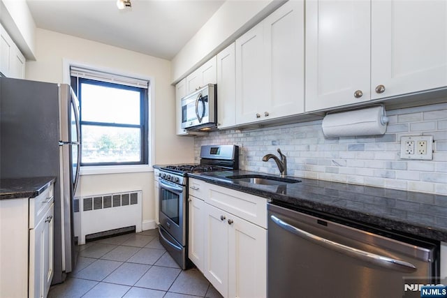 2333 Hudson Ter Unit A4, Fort Lee, NJ 07024 - kitchen with appliances with stainless steel finishes, radiator, a sink, and white cabinetry