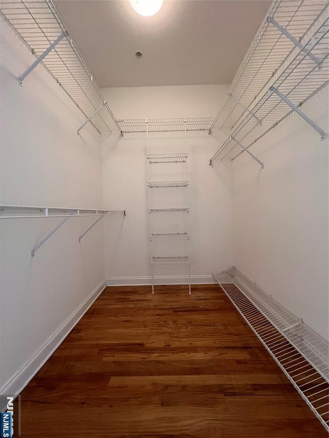 1100 River Rd Unit 206, Edgewater, NJ 07020 - walk in closet featuring wood finished floors