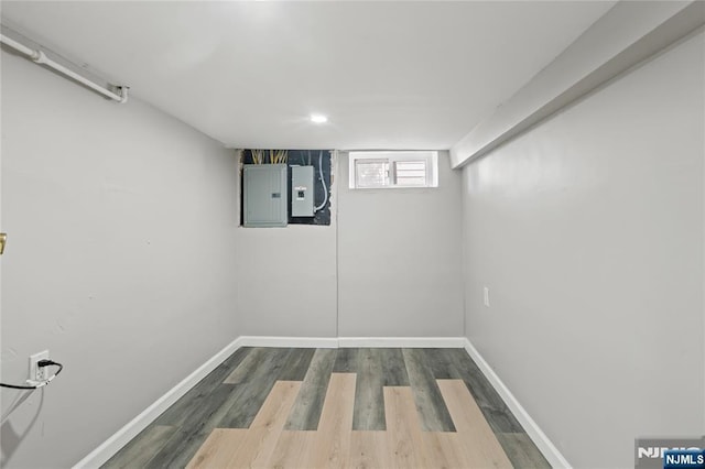 190 Washington Ave, Hackensack, NJ 07601 - basement featuring electric panel, baseboards, and dark wood finished floors