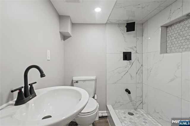 190 Washington Ave, Hackensack, NJ 07601 - full bath with toilet, a sink, a tile shower, and recessed lighting