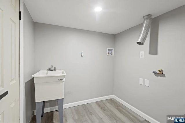 190 Washington Ave, Hackensack, NJ 07601 - laundry room with hookup for a washing machine, wood finished floors, and baseboards
