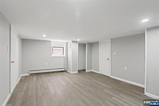 190 Washington Ave, Hackensack, NJ 07601 - below grade area featuring baseboard heating, light wood-type flooring, baseboards, and recessed lighting