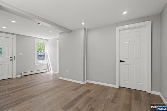 190 Washington Ave, Hackensack, NJ 07601 - interior space with a baseboard heating unit, wood finished floors, recessed lighting, and baseboards