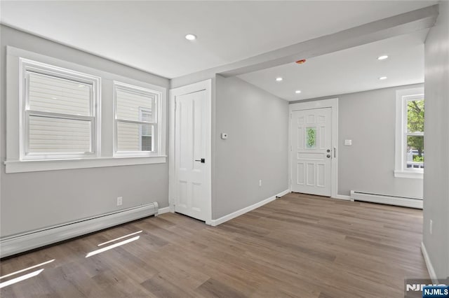 190 Washington Ave, Hackensack, NJ 07601 - foyer entrance with a baseboard radiator, baseboard heating, wood finished floors, baseboards, and recessed lighting