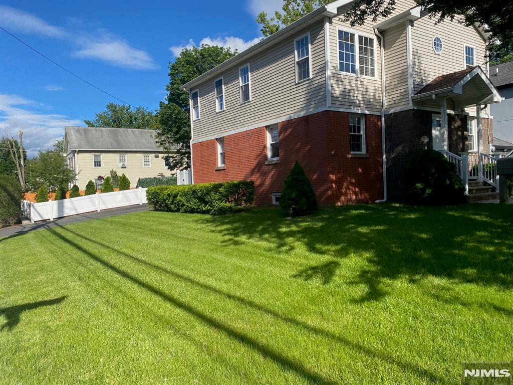 13-53 Sunnyside Dr, Fair Lawn, NJ 07410 - view of property exterior featuring brick siding
