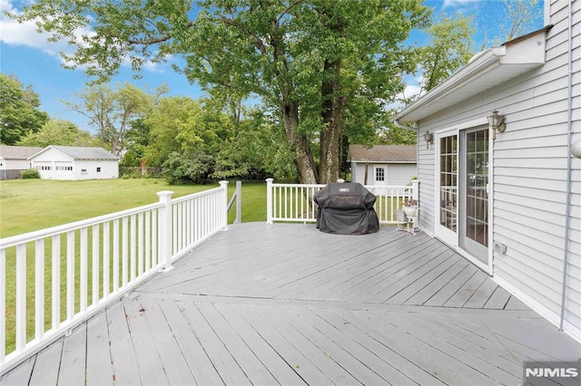 99 Comly Rd, Lincoln Park Borough, NJ 07035 - wooden terrace with a lawn and a grill