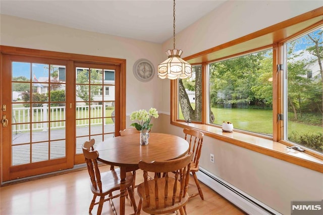 99 Comly Rd, Lincoln Park Borough, NJ 07035 - dining room with baseboard heating, a chandelier, and light wood-style floors