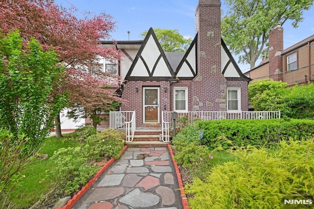 497 Oakdene Ave, Ridgefield, NJ 07657 - tudor-style house with stucco siding and brick siding