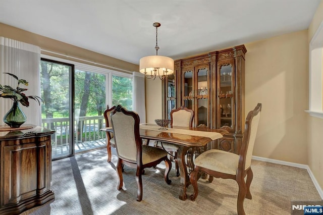 65 Cummings Ct, Mahwah, NJ 07430 - dining area featuring a chandelier, carpet flooring, and baseboards