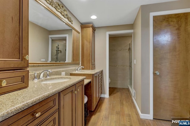 65 Cummings Ct, Mahwah, NJ 07430 - full bathroom with toilet, vanity, wood finished floors, baseboards, and recessed lighting