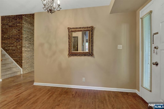 65 Cummings Ct, Mahwah, NJ 07430 - entrance foyer with baseboards, wood finished floors, a chandelier, and stairs