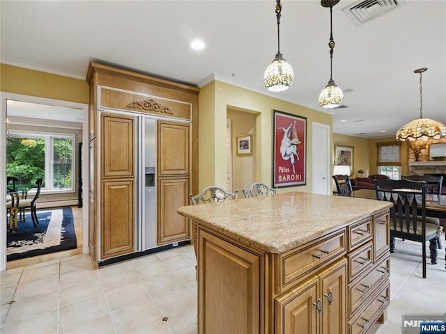 20 Tuxedo Ave, Park Ridge, NJ 07656 - kitchen with crown molding, decorative light fixtures, light stone counters, a center island, and light tile patterned flooring