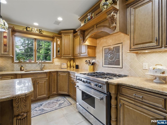 20 Tuxedo Ave, Park Ridge, NJ 07656 - kitchen featuring high end range, light stone countertops, a sink, brown cabinetry, and glass insert cabinets
