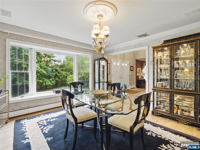 20 Tuxedo Ave, Park Ridge, NJ 07656 - dining space with a chandelier, wood finished floors, ornamental molding, and a baseboard radiator