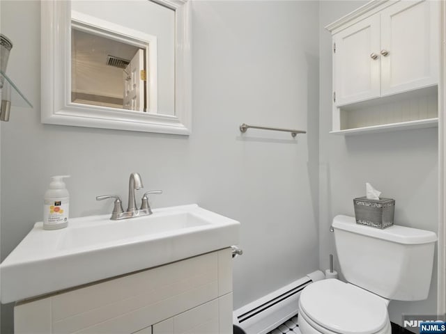 20 Tuxedo Ave, Park Ridge, NJ 07656 - bathroom with a baseboard heating unit, toilet, and vanity