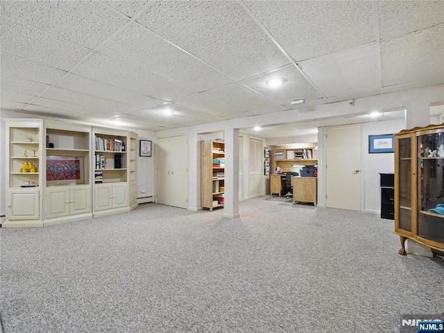 20 Tuxedo Ave, Park Ridge, NJ 07656 - finished below grade area featuring carpet flooring, a baseboard heating unit, and a paneled ceiling