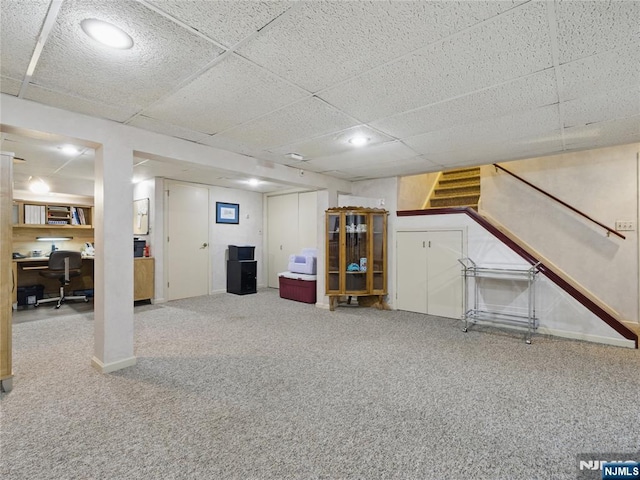 20 Tuxedo Ave, Park Ridge, NJ 07656 - finished below grade area featuring a desk, carpet flooring, stairs, a paneled ceiling, and baseboards
