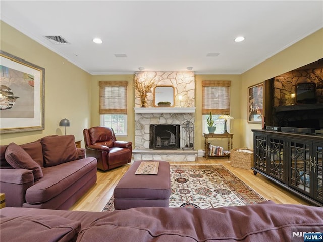 20 Tuxedo Ave, Park Ridge, NJ 07656 - living area with wood finished floors, ornamental molding, a fireplace, and recessed lighting