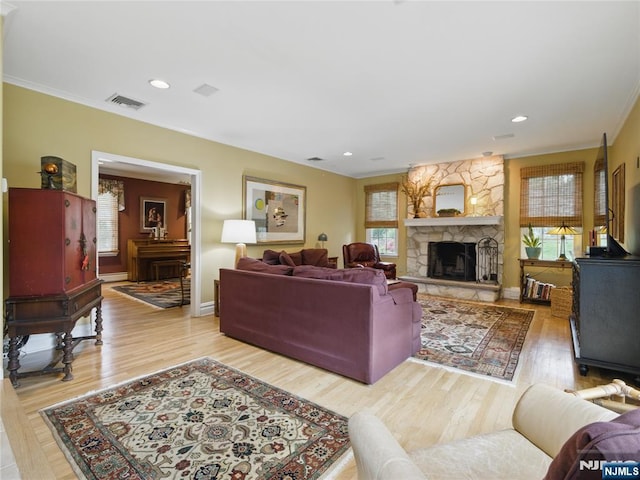 20 Tuxedo Ave, Park Ridge, NJ 07656 - living room featuring ornamental molding, light wood-style flooring, a stone fireplace, baseboards, and recessed lighting