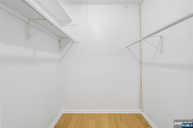 100 Grand Cove Way Unit 2D, Edgewater, NJ 07020 - walk in closet with wood finished floors