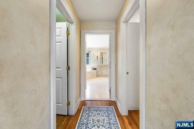 50 Claremont Rd, Fort Lee, NJ 07024 - corridor featuring wood finished floors