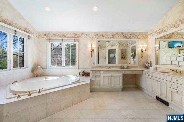 50 Claremont Rd, Fort Lee, NJ 07024 - full bathroom featuring vaulted ceiling, a bath, vanity, tile patterned floors, and wallpapered walls