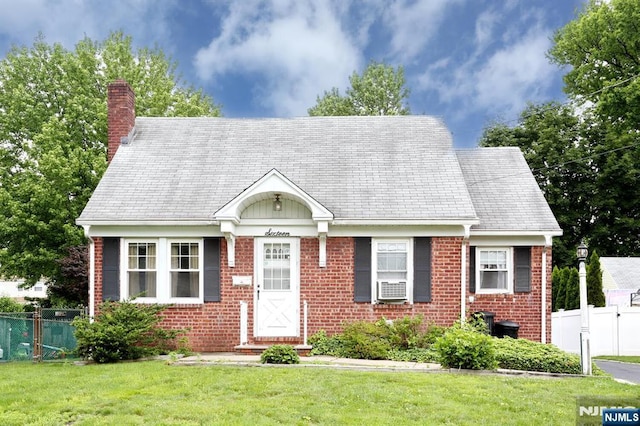 16 Merritt Ave, Dumont, NJ 07628 - cape cod home with a chimney, brick siding, and cooling unit