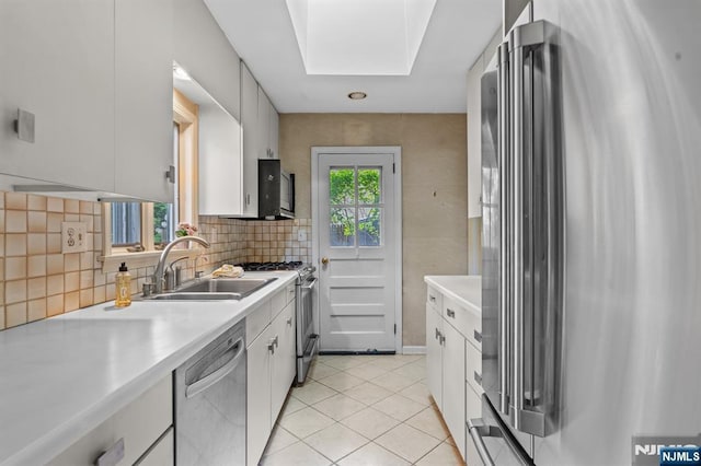15 Strawberry Hill Rd, Hillsdale, NJ 07642 - kitchen with stainless steel appliances, a sink, light countertops, decorative backsplash, and white cabinets