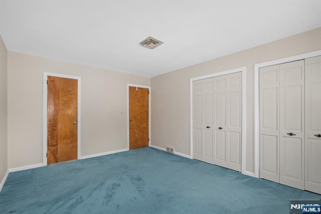 15 Strawberry Hill Rd, Hillsdale, NJ 07642 - unfurnished bedroom with carpet, baseboards, and multiple closets