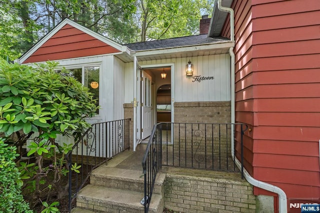 15 Strawberry Hill Rd, Hillsdale, NJ 07642 - view of exterior entry featuring a chimney