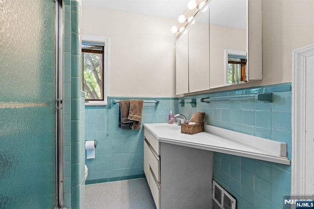 15 Strawberry Hill Rd, Hillsdale, NJ 07642 - full bath featuring tile walls, vanity, a shower stall, tile patterned flooring, and wainscoting