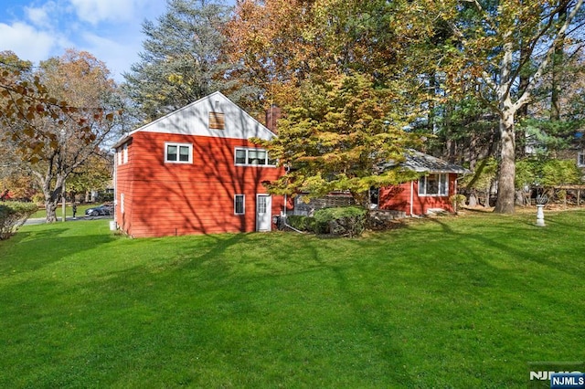 15 Strawberry Hill Rd, Hillsdale, NJ 07642 - view of home's exterior with a lawn