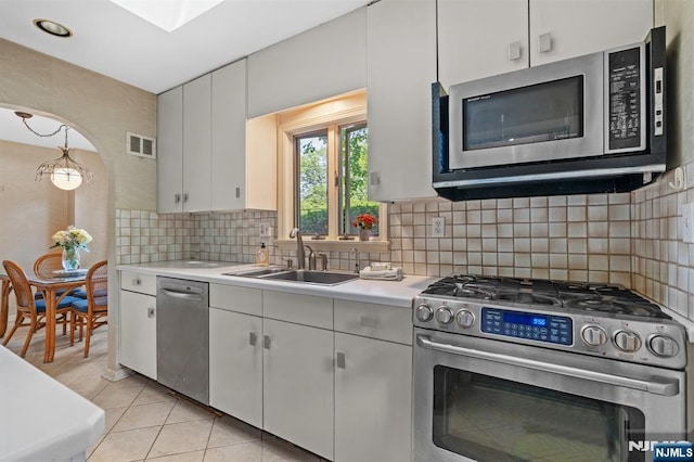 15 Strawberry Hill Rd, Hillsdale, NJ 07642 - kitchen featuring appliances with stainless steel finishes, light countertops, a sink, and white cabinets