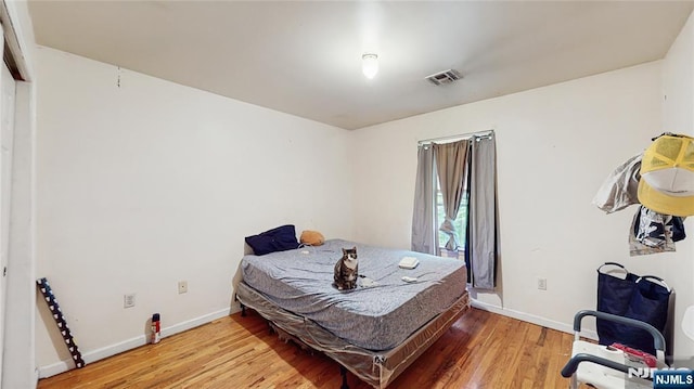 129-131 Seymour Ave, Newark, NJ 07108 - bedroom featuring wood finished floors and baseboards