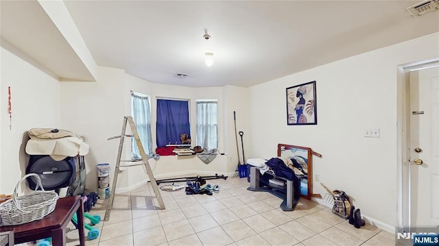129-131 Seymour Ave, Newark, NJ 07108 - workout room featuring light tile patterned floors and baseboards