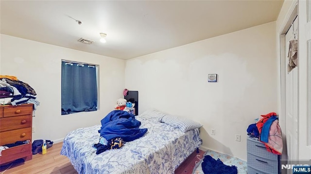 129-131 Seymour Ave, Newark, NJ 07108 - bedroom with wood finished floors and baseboards