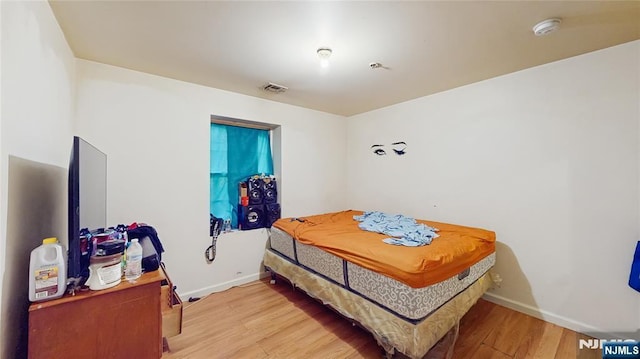 129-131 Seymour Ave, Newark, NJ 07108 - bedroom featuring wood finished floors and baseboards